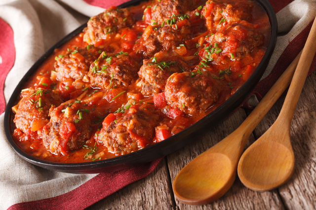 Delicious Meatballs albondigas with spicy sauce on a plate close